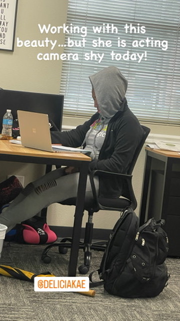 A Benefits Boss team member focused at her desk during a workday