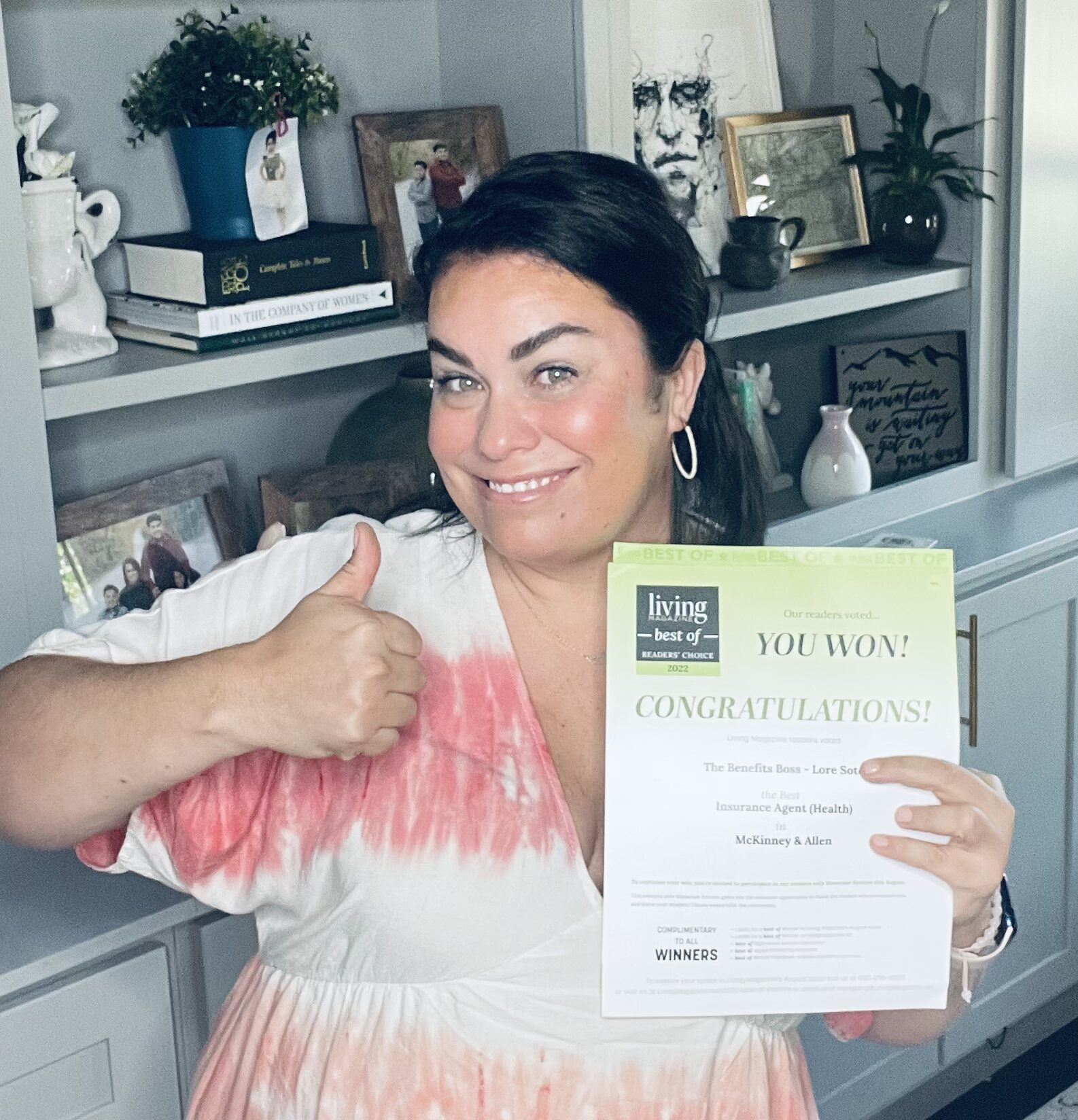 Lore Soto holding her Living Magazine Best Of Readers' Choice award for Best Health Insurance Agent in McKinney and Allen
