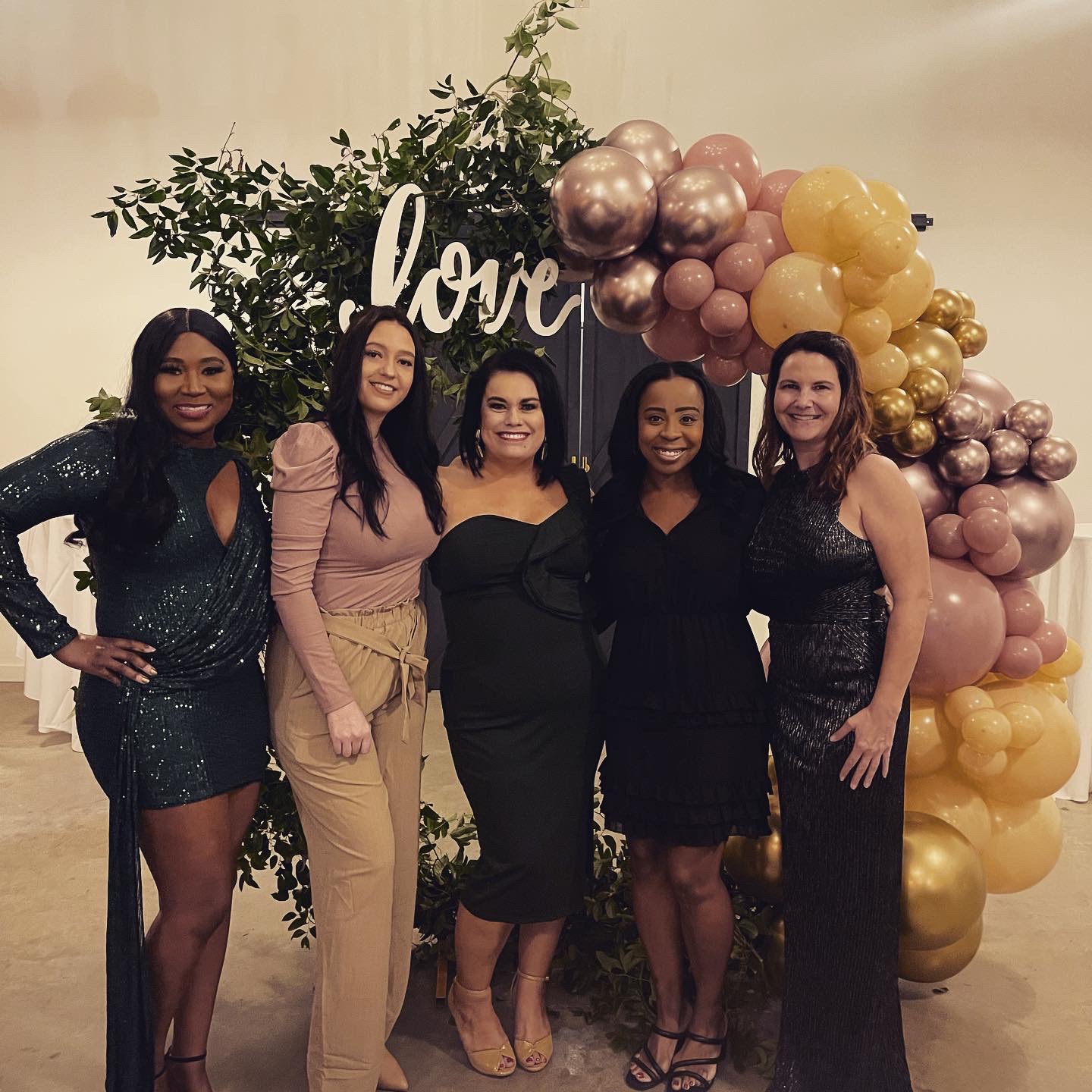 Five members of The Benefits Boss team dressed up at a company celebration