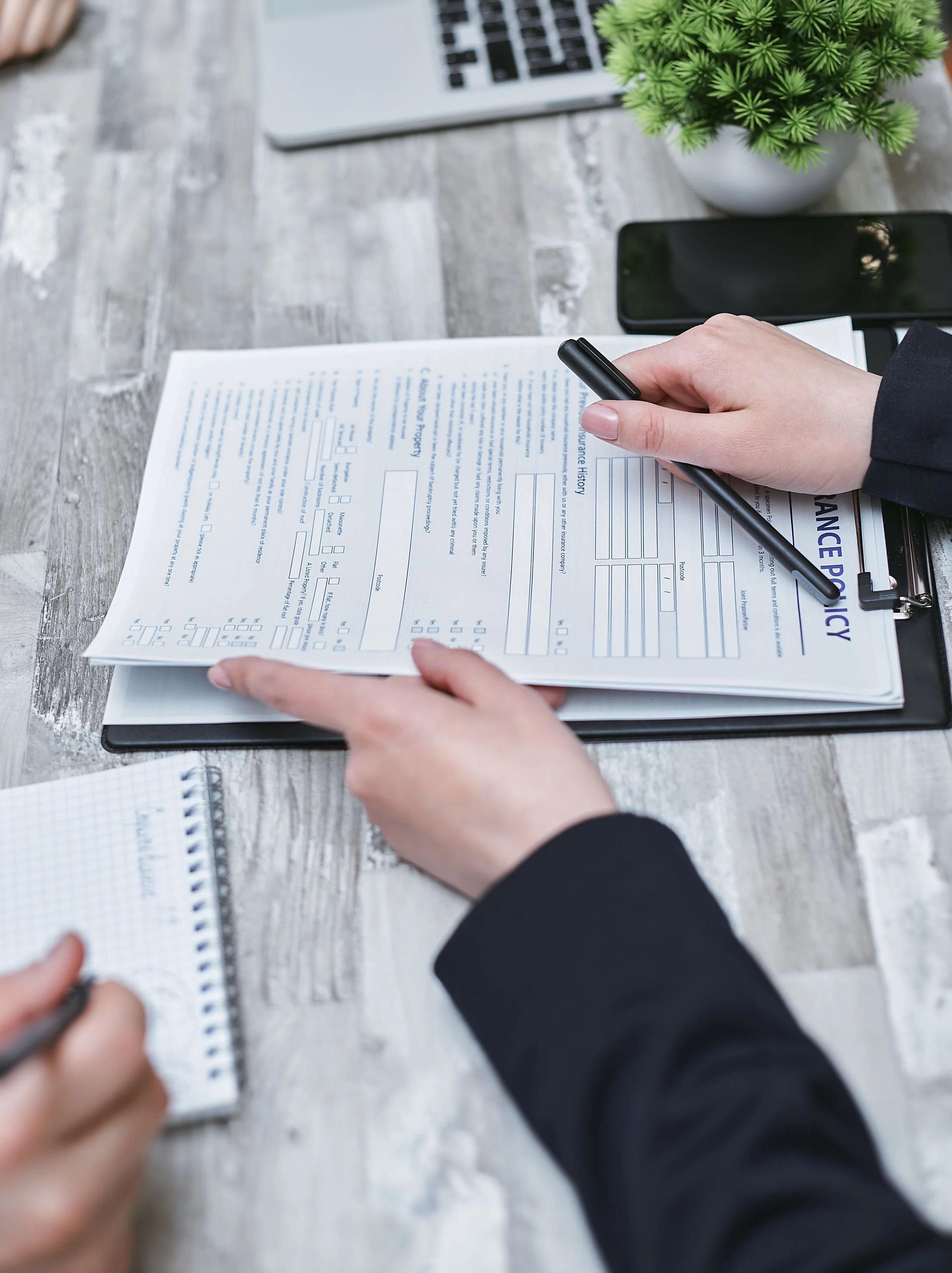 client reviewing health insurance paperwork and deductible options