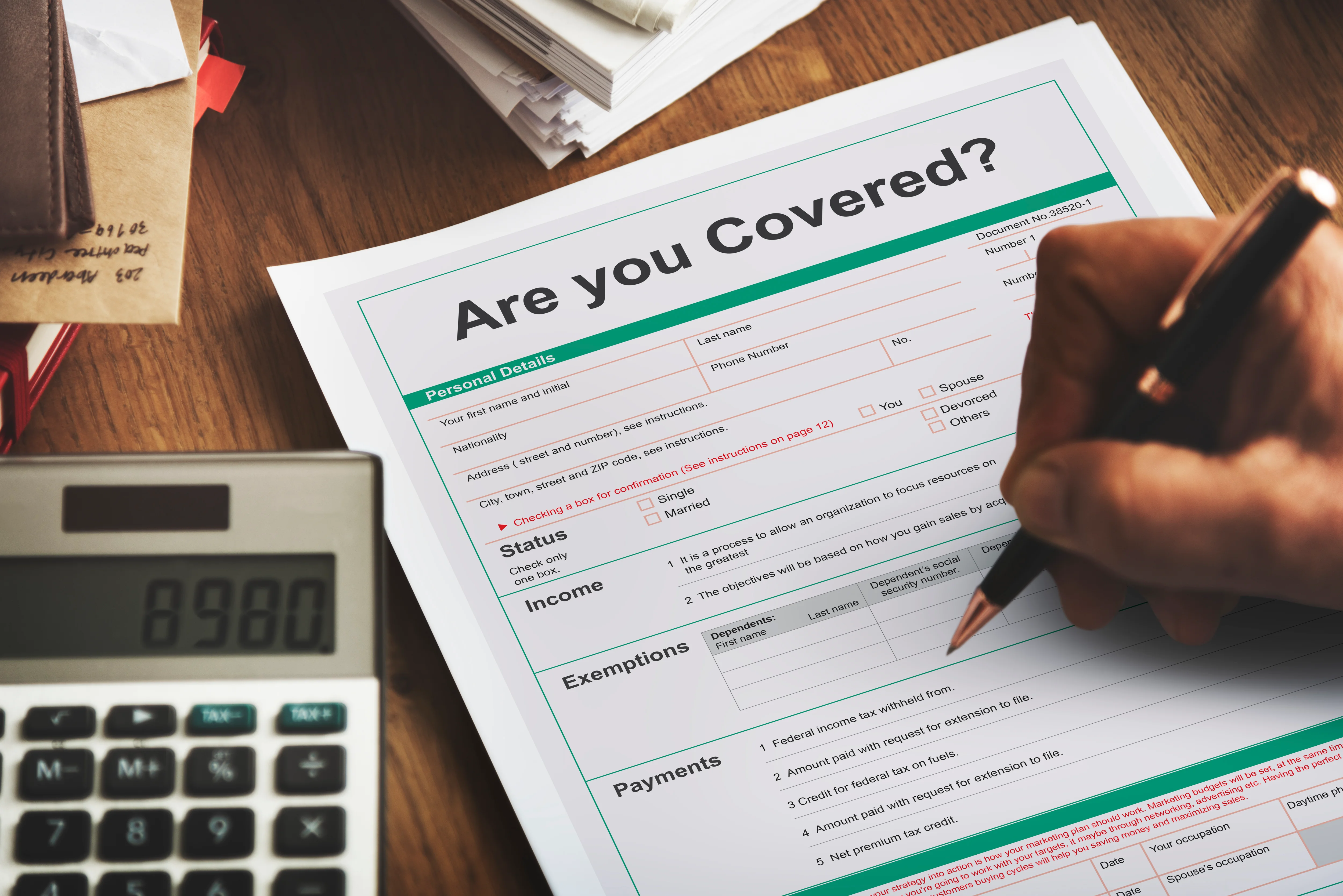 Close up of paper asking are you covers with man writing in information