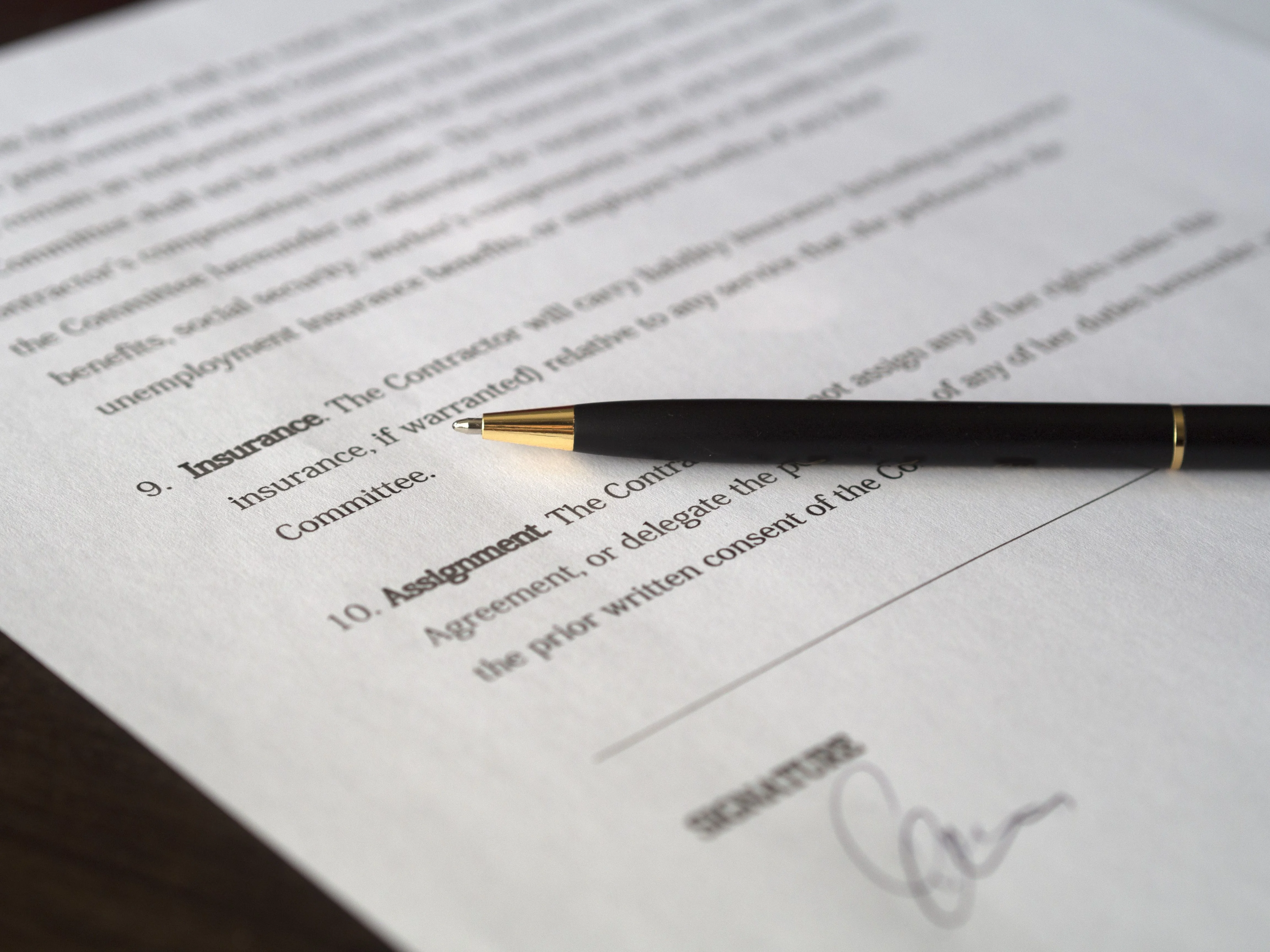 close up of ppo insurance paperwork agreement with pen on top
