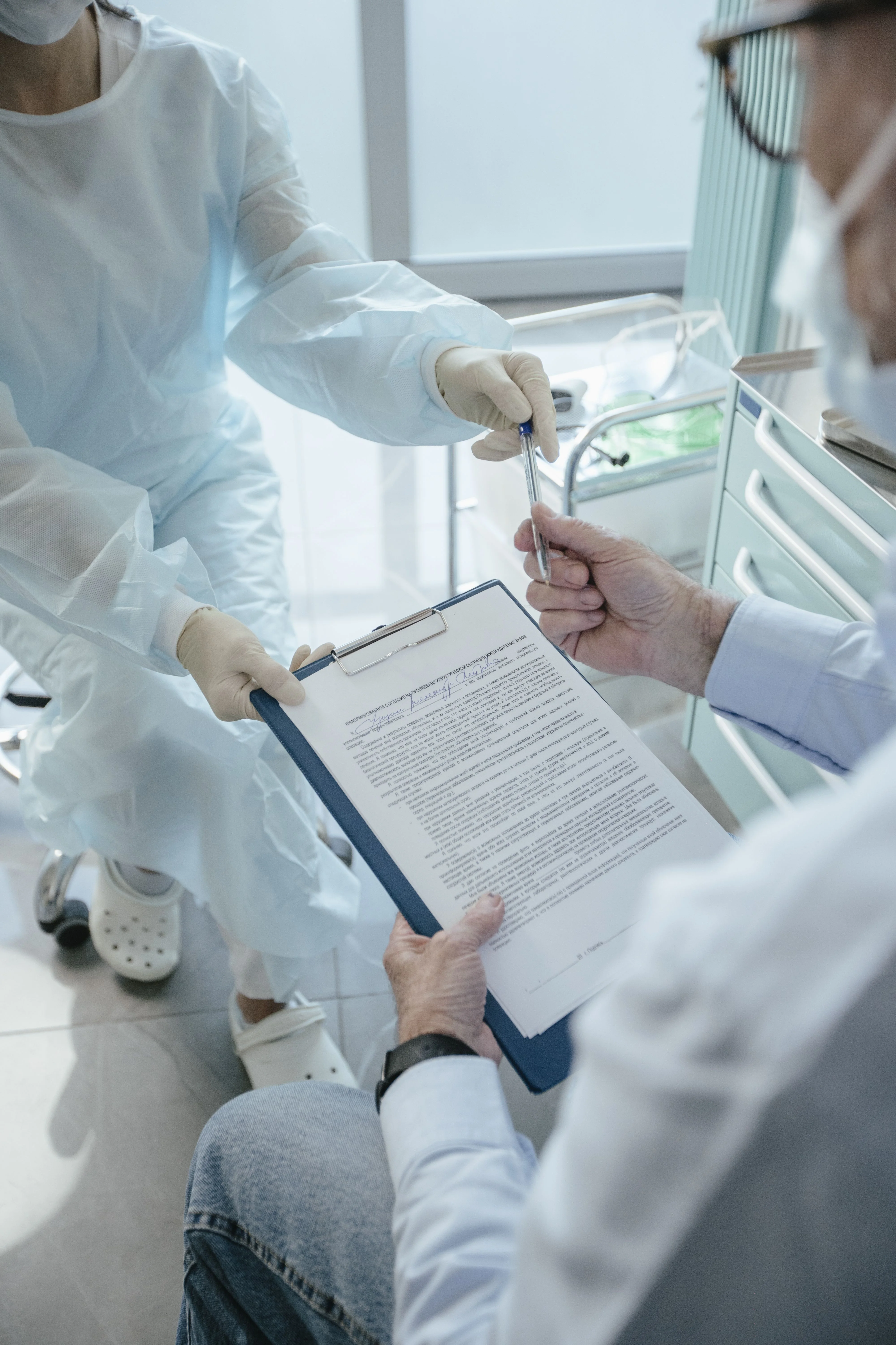 doctors analyzing insurance paperwork before procedure