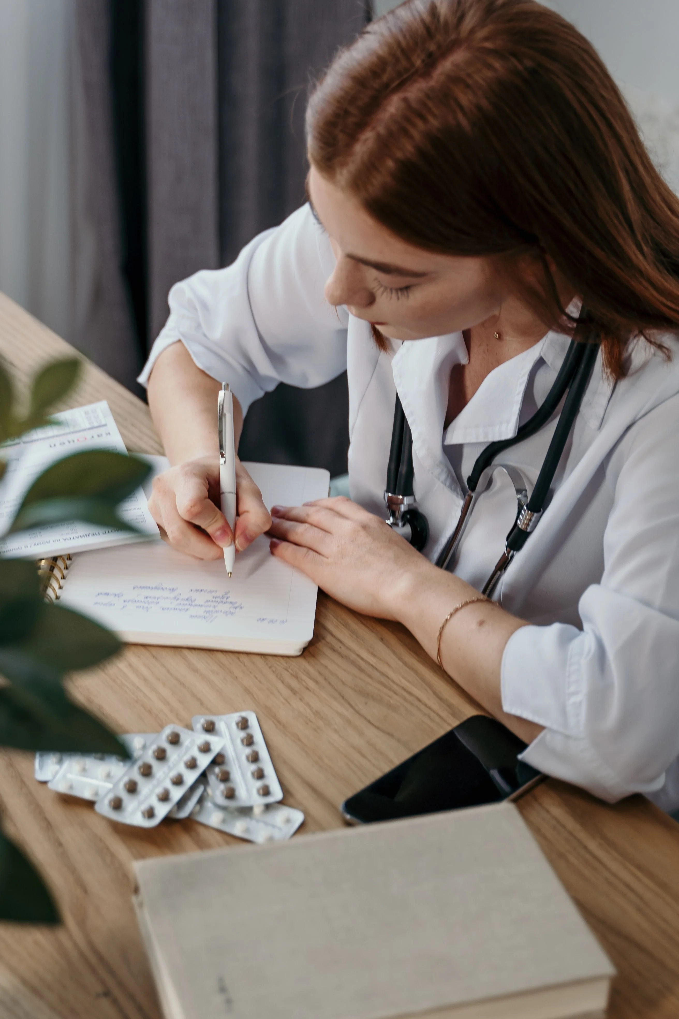 Female healthcare professional reviewing patient records