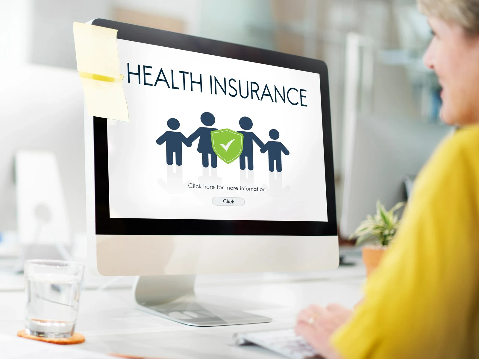 Health insurance webpage with family icon on desktop computer screen