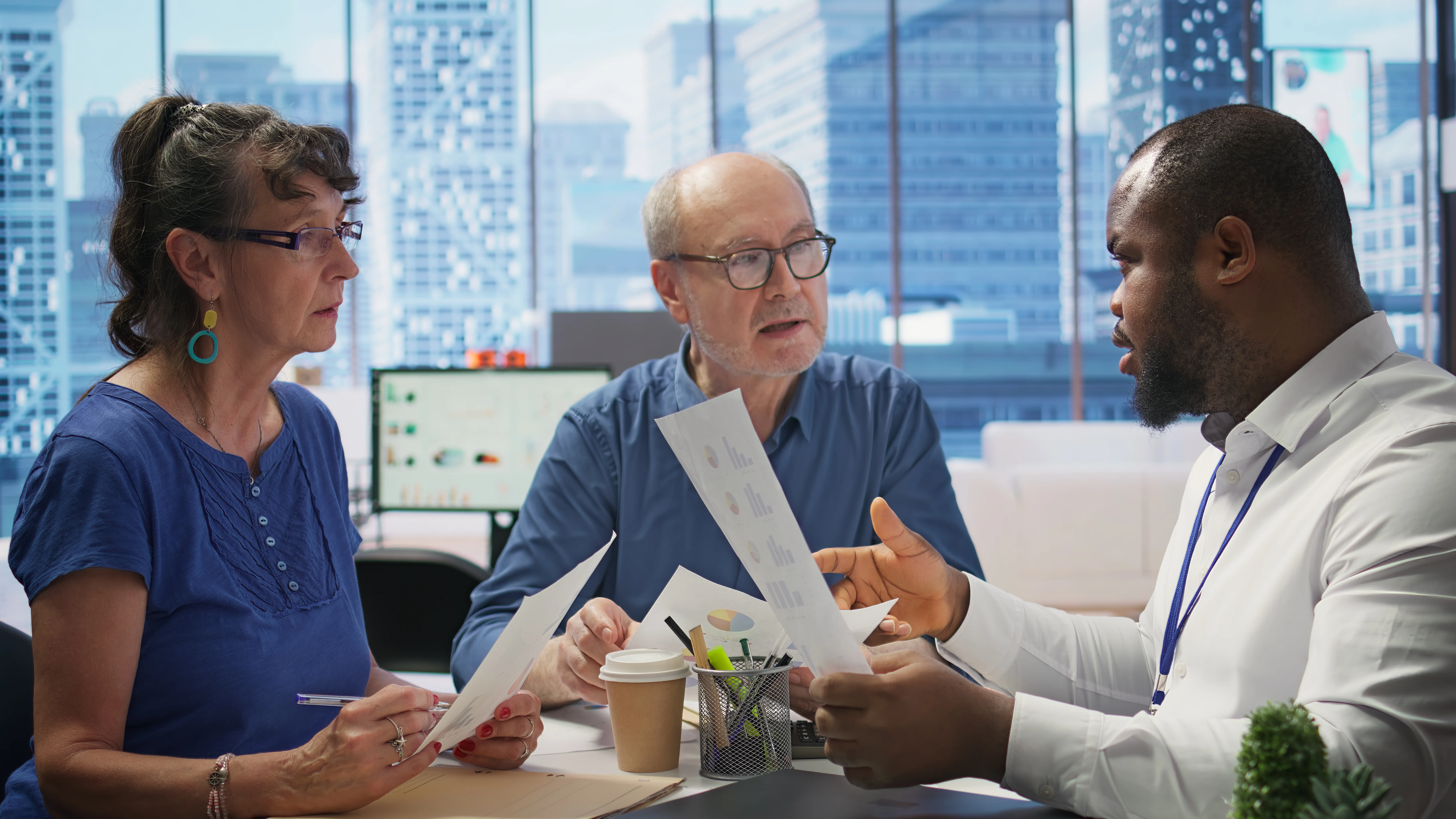 senior people discussing pension financial strategy with broker