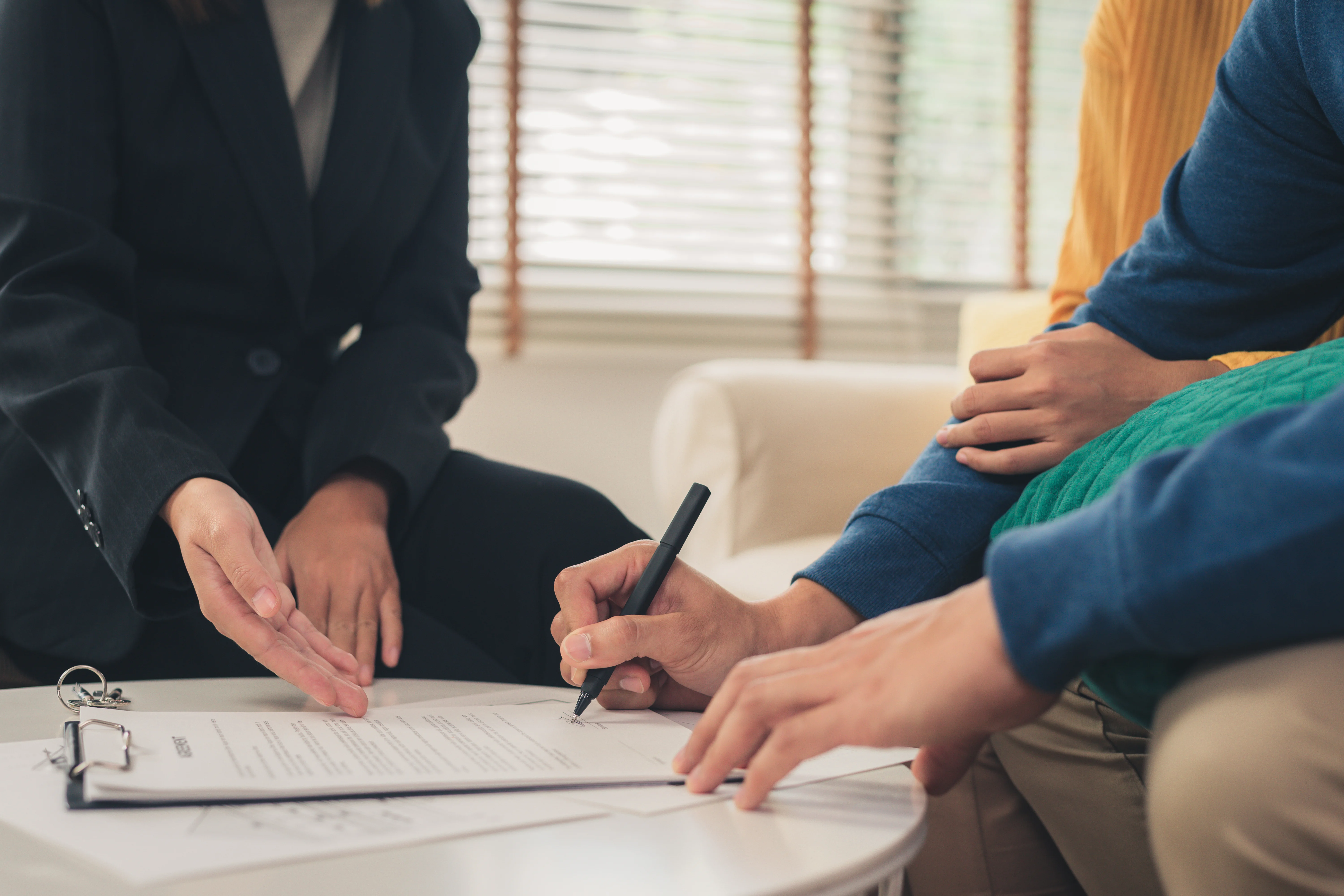 Unemployed client signing health insurance policy